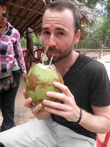 Enjoying fresh coconuts on our way around the temples.