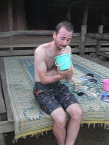 Darren getting the last drop of his Laos whiskey!