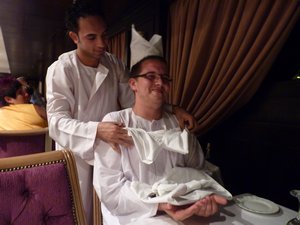 77. The waiter made a hat, boobies, and a baby in a blanket out of serviettes