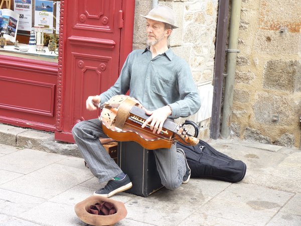 28. Busker #2 - He has to turn the handle on the side