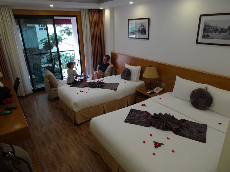 Accommodation in Hanoi with rose petals on bed