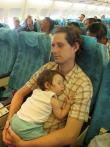 Liya and Yaron sleeping on the flight to Istanbul
