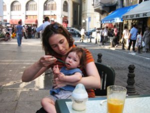 liya drinking orange juice on the street