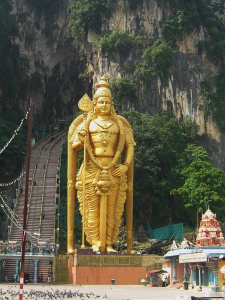 Giant Golden Statue guards the entrance to Batu Cave