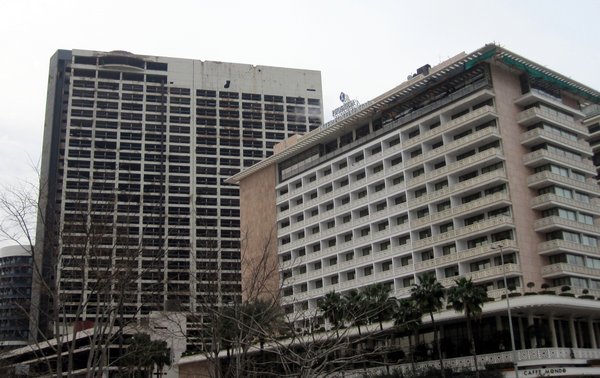 The bullet-ridden Holiday Inn (on the left)
