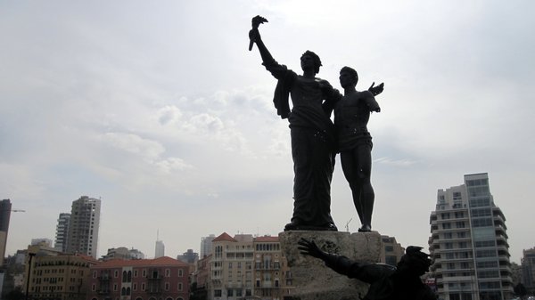 Bullet holes poke through the statues of Martyrs' Square
