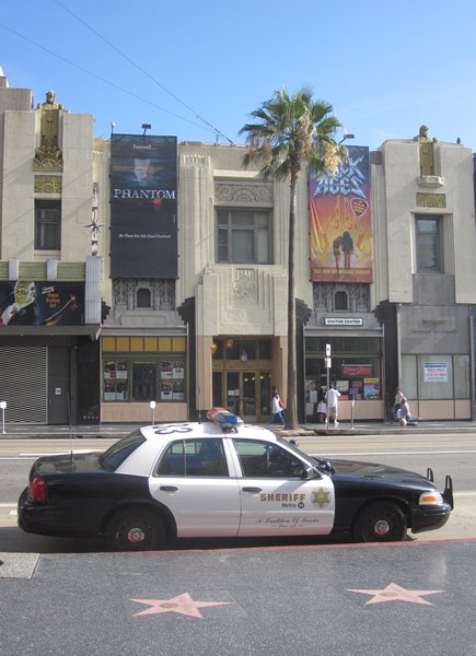 Cop car guards the Hollywood Walk of Fame