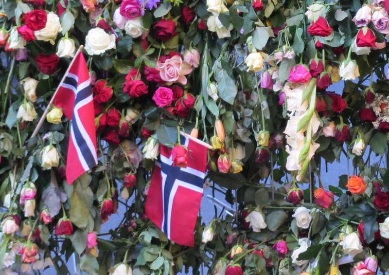 Flowers and flags pay their respect