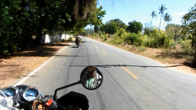 Riding on the back of a motorbike