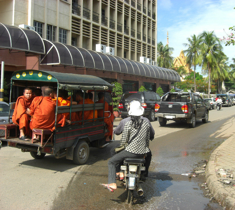 Monks travel by tuk-tuk