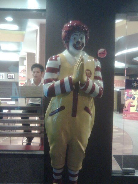 Ronald McDonald doing a wai