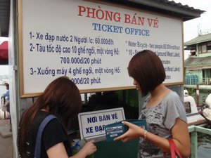 Anh and friend buying swan tickets