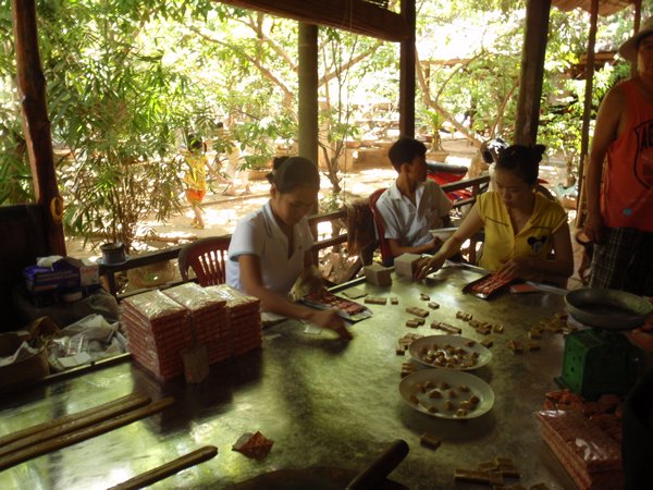 women making coconut candy