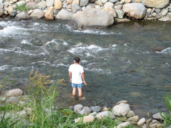 Joe "Swimming" in the Stream by Our Hostel
