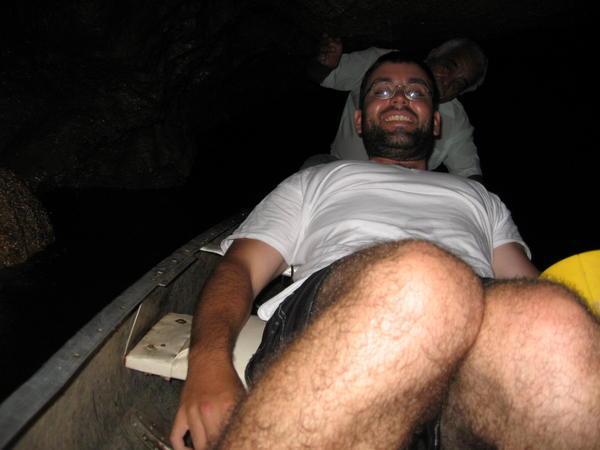Joe (Ducking) in the Canoe Inside the Cave