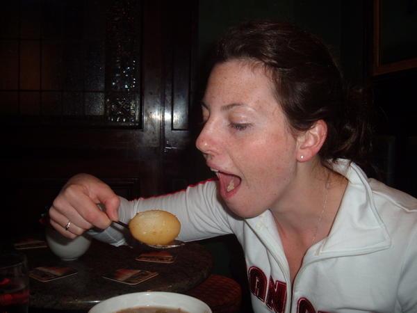 Sarah eating the massive Potato from the Irish Stew