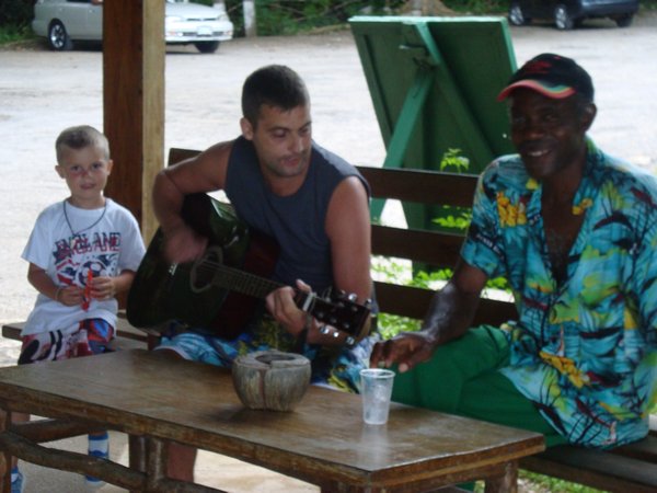 Matt teaching a Jamaican how to jam!