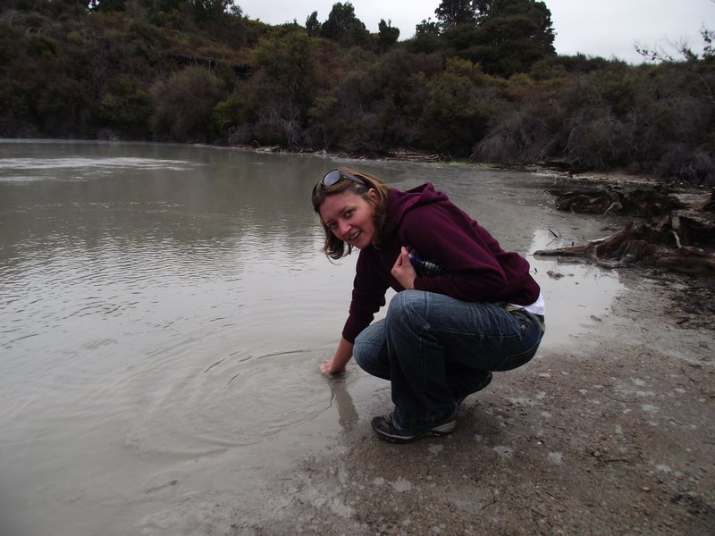 Rachel cleaning her hands in the Sulphur Lake