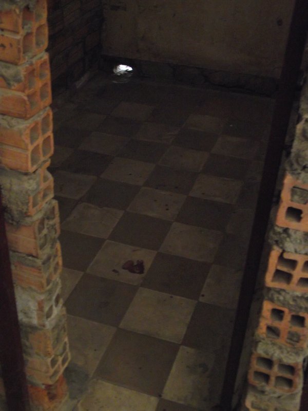 Small cell with blood stained floor