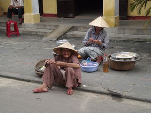 Two ladies in the street in Hoi An