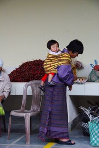 Woman in Kira with baby