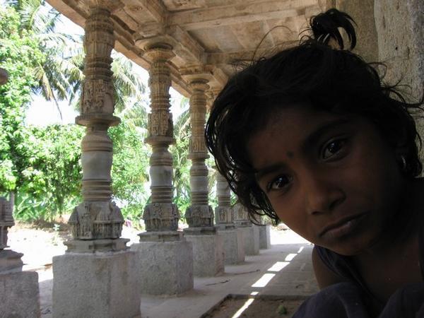 curious girl in the Shiva temple in Anegondi