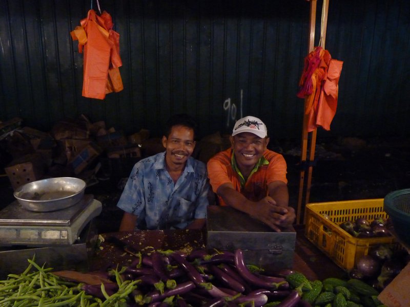 Two photo-happy fruit sellers 