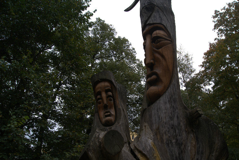 Faces Carved in Tree