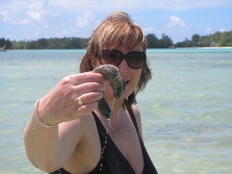 Jane holding a 'Sea Cucumber' at Muri Lagoon