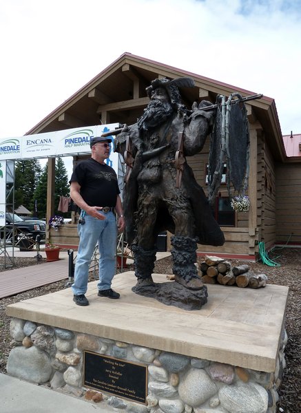 George with the Mountain Man statue