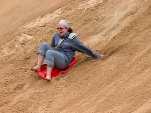 Sandboarding on the Te Paki giant sand dunes, Northland