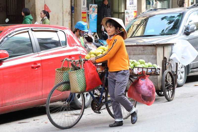 local on her bike taking fruit around to sell..