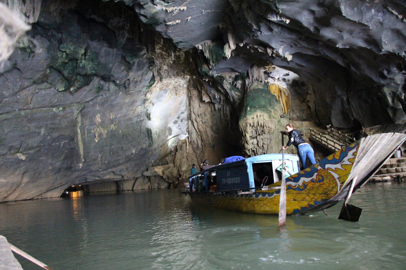 Our guides paddling into the cave