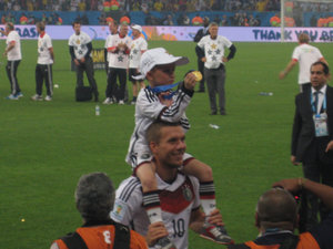 Podolski with his son