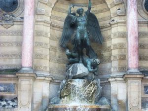 we went on a free tour that started here, a fountain with michael the archangel kicking satan out of heaven
