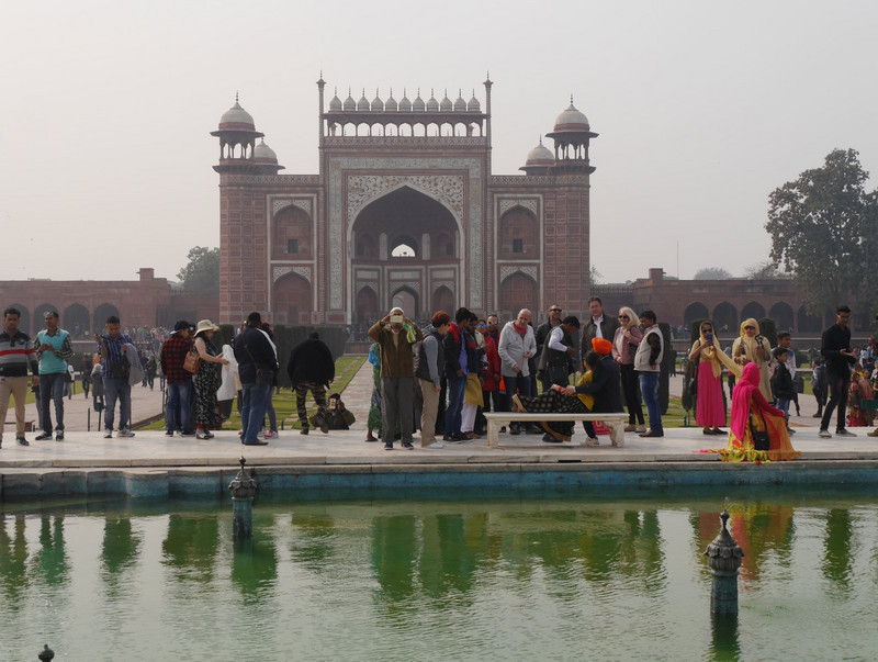 Taj Mahal gateway and people being photographed