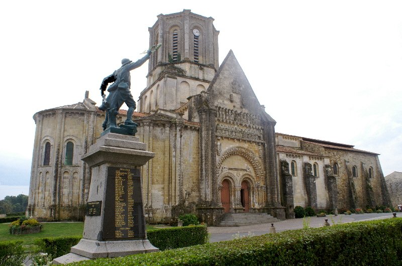 Ancient Vouvant church and war memorial