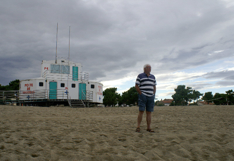 Bob admires the very long sandy beach of Argeles-sur-mer while ensuring he is safe by standing in front of Rescue station no. 4.