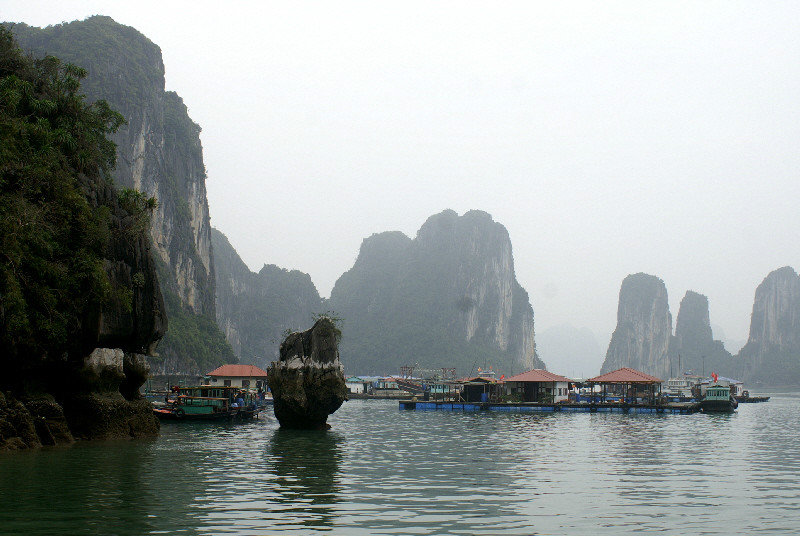 Fishing village in the shade of the limestone karsts