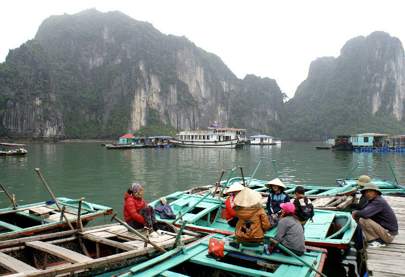 People from the fishing village selling their wares in a mini floating market