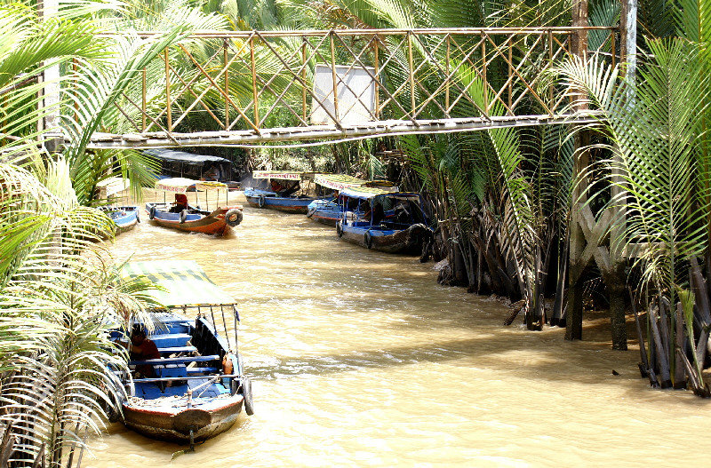 middle size boats on one of the rivers which criss cross the islands. Note the bridge. 