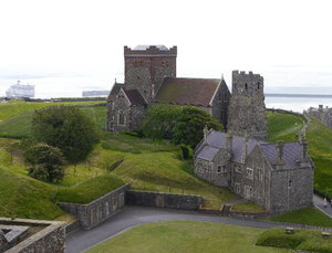 Dover Castle - the church and the lighthouse with a view to the sea beyond