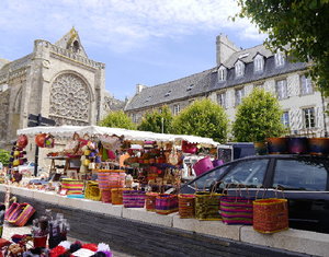 St-Pol-de-Leon Cathedral Rose window and a very colourful market stall