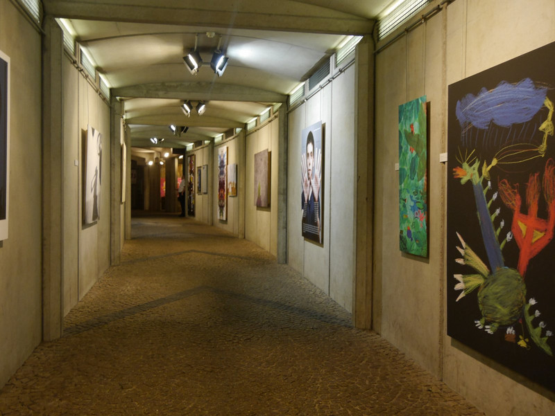 The tunnel to the lift nicely decorated with artwork