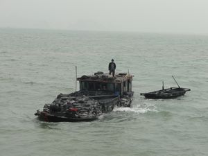 Fishing boat, overloaded and hardly sea worthy