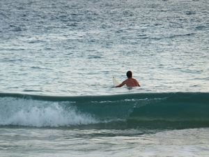 Catching a surf at Lampuuk beach