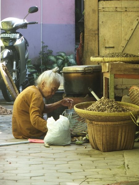 It's a slow pace of life... Little old lady, Yogyakarta.