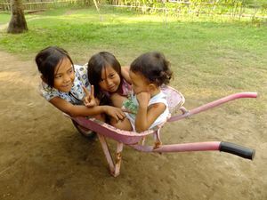Kids in the wheelbarrow...ready to be kidnapped by Nina!