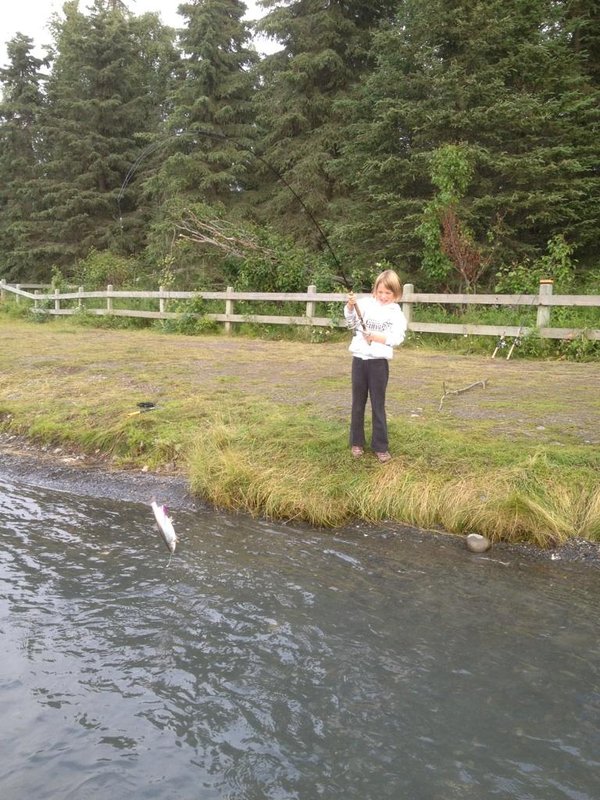 Maggie landing the first little salmon