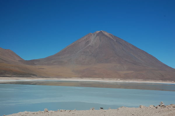 Green Lagoon with Volcano in the Back in Desert